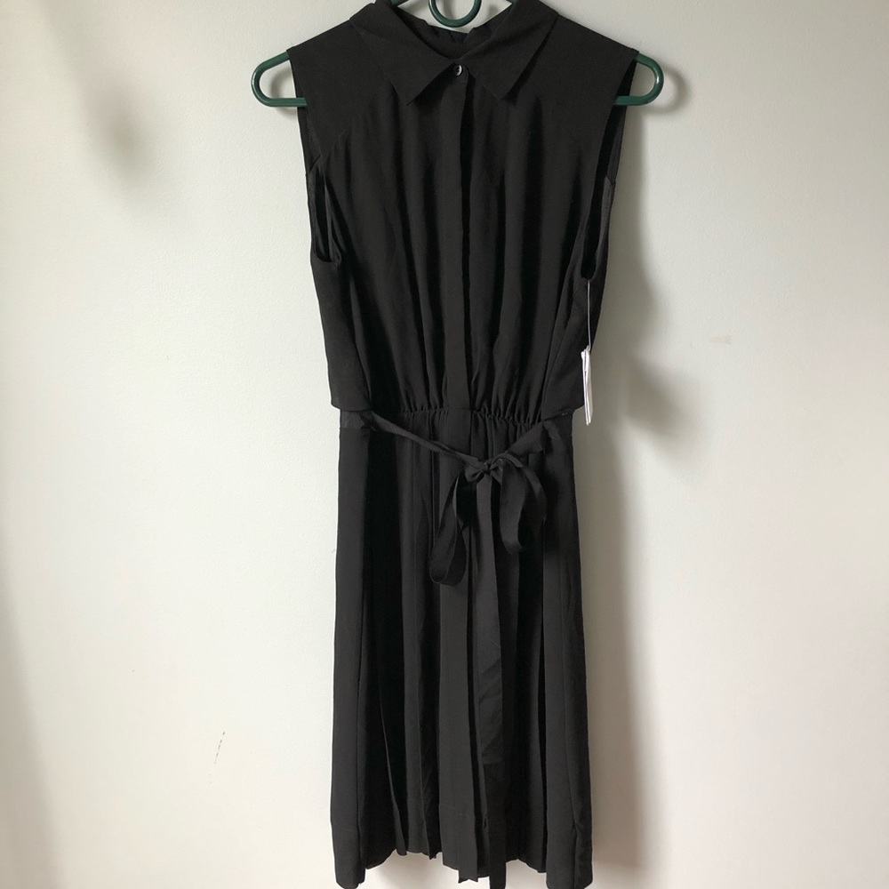 black flowy dress with collar and a fancy back